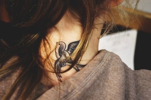 girl tattoos neck