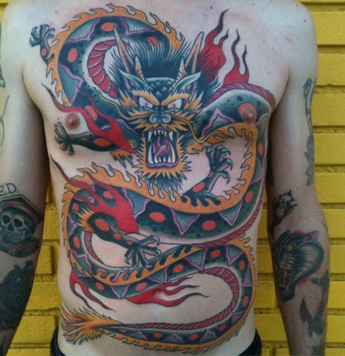 Dragon tattoo at chest