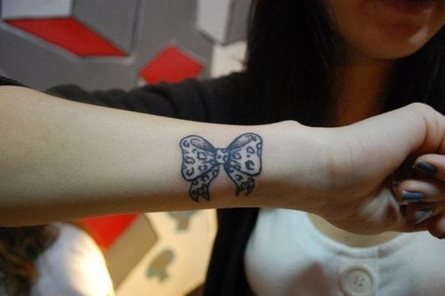 Ribbon tattoo for girl