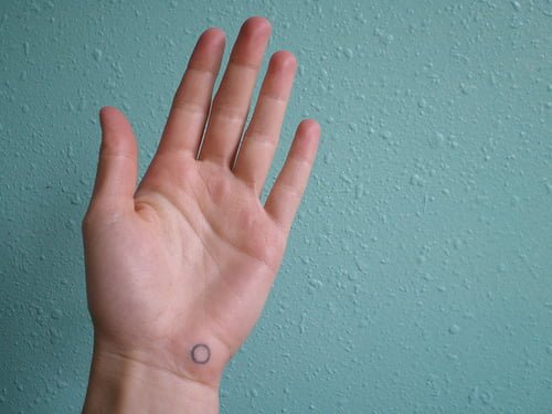 circle tattoos on hand