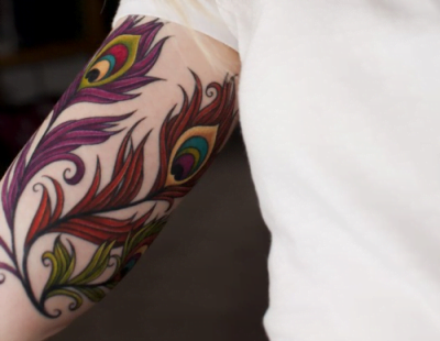 Peacock feathers tattoo