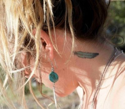 feather tattoo on the neck