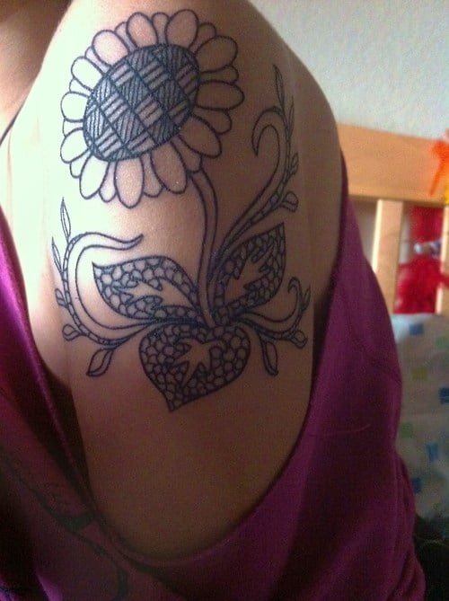 Shoulder tattoo of sunflower