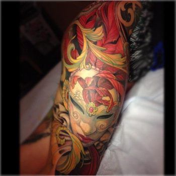 Venecian mask tattoo