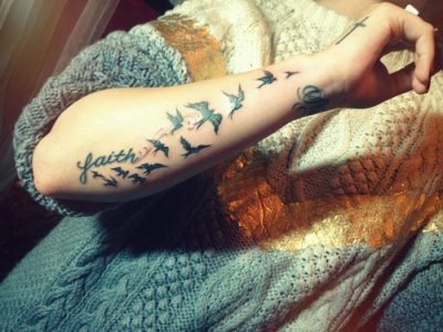 Bird tattoos on arm