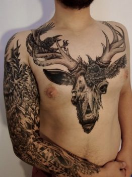 Chest and arm tattoo