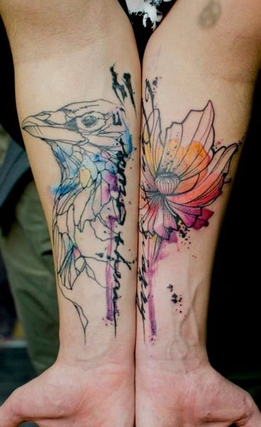 Flower and bird tattooed on arms