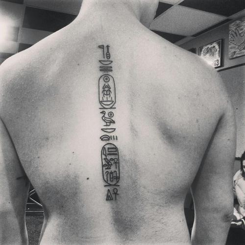 hieroglyphic tattoo on back