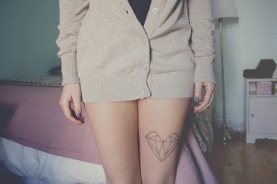 Hipster heart tattoo on leg