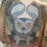 Owl tattoo at the back