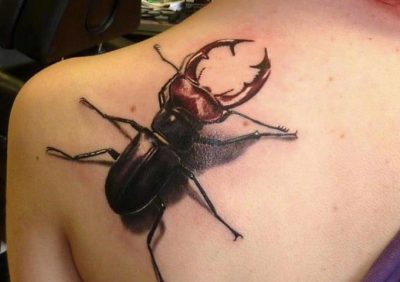 beetle tattoo on the back
