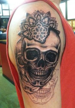 Skull tattoos on shoulder