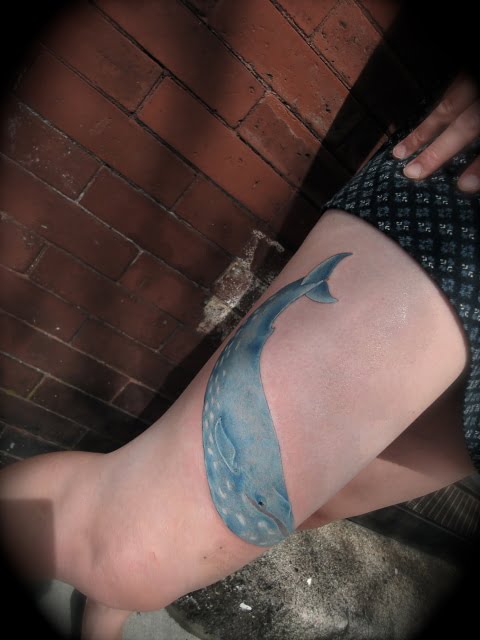 Whale tattoo on leg