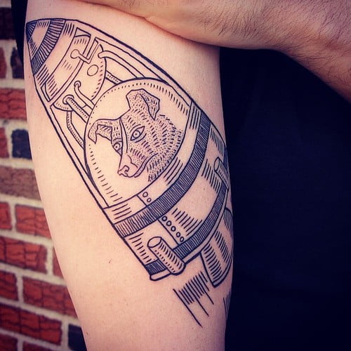 Tatuaje Laika en el brazo