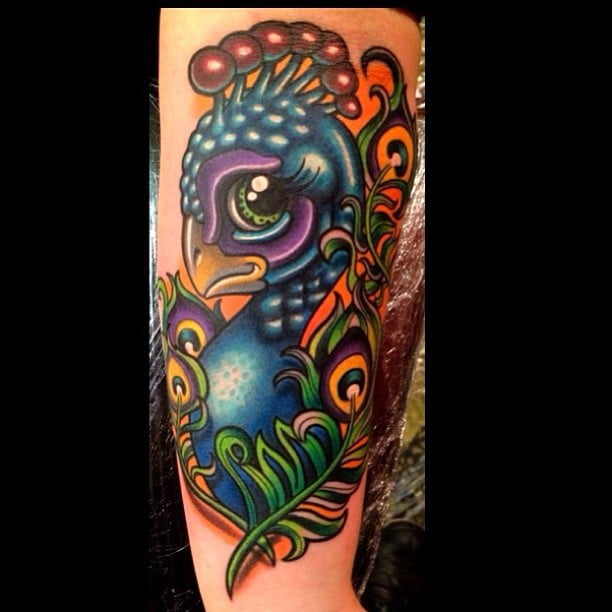Tatuaje pavo real en el brazo