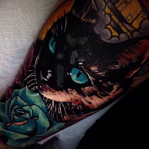 Tatuaje gato ojos azules