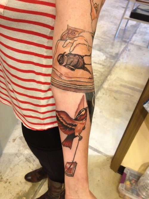 Tatuaje pájaros en el brazo